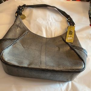 Gray Brahmin bag with dust cover.